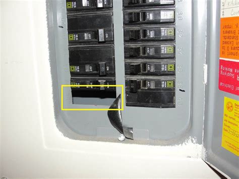 What is a missing knockout or open knockout in an electric panel 